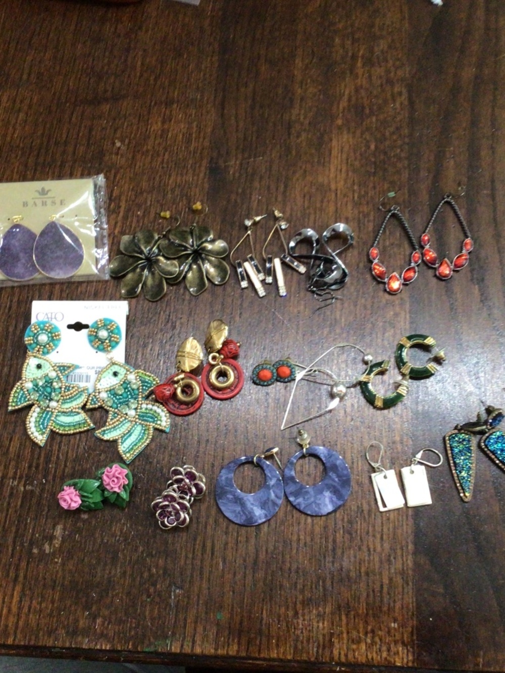 15 pair of fashion earrings. All in good shape. Two new with tags